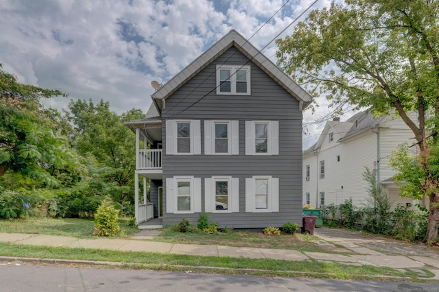 view of front of house with a balcony