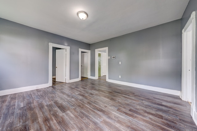 unfurnished bedroom with hardwood / wood-style floors