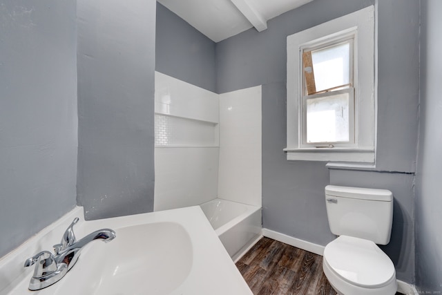 bathroom with hardwood / wood-style flooring, toilet, and sink