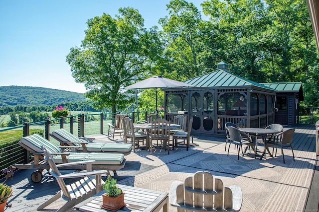 view of patio / terrace featuring a gazebo and a wooden deck