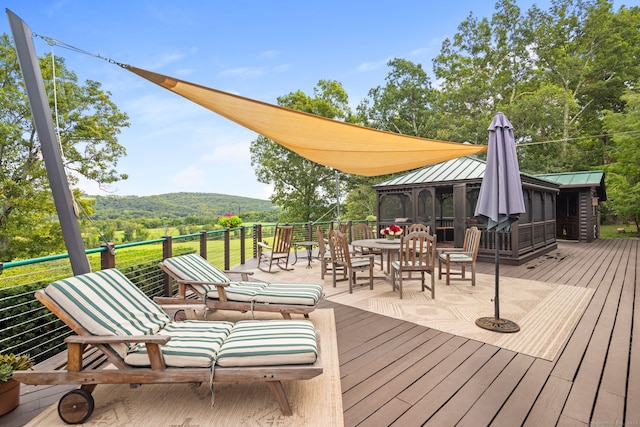 deck with a gazebo and a mountain view