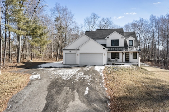 view of front of home with a garage and covered porch