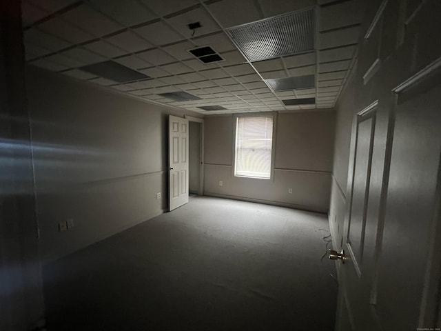 empty room with a drop ceiling