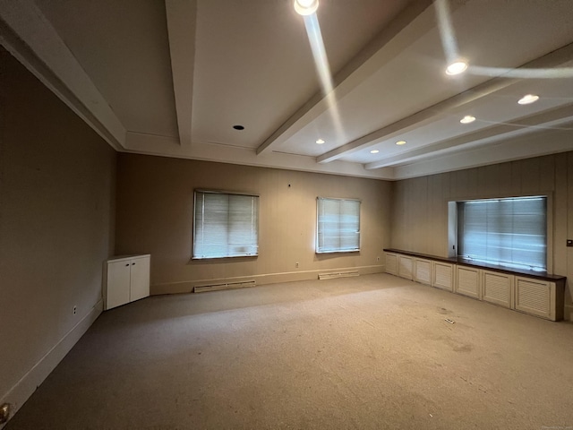 unfurnished living room featuring beam ceiling and light carpet