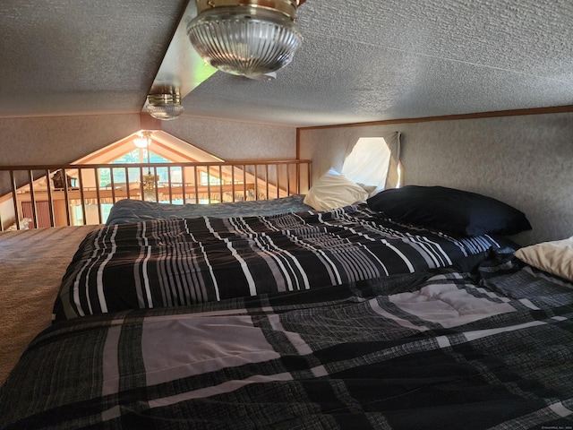 bedroom featuring carpet flooring, lofted ceiling, and a textured ceiling