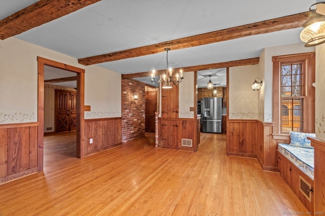 interior space featuring light hardwood / wood-style flooring and an inviting chandelier