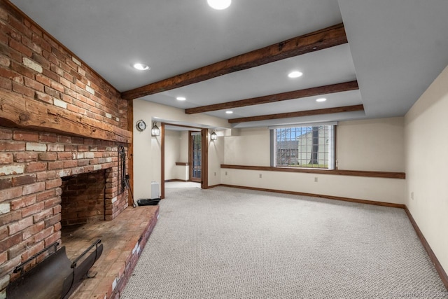 unfurnished living room with beam ceiling, light colored carpet, and a brick fireplace