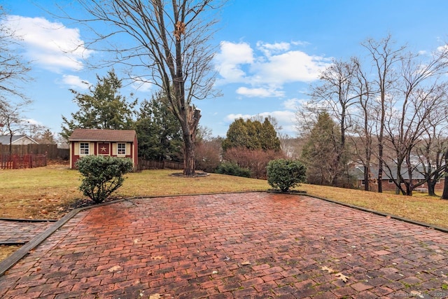 view of patio with an outbuilding