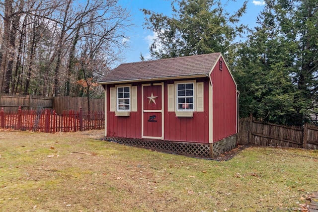 view of outbuilding with a lawn