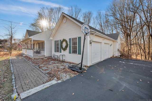 view of front of house with a porch and a garage