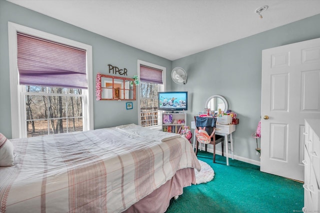 bedroom featuring carpet floors and multiple windows