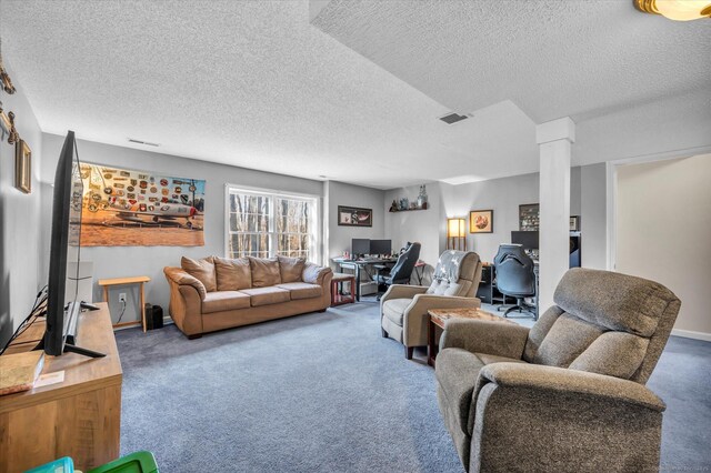 living room featuring carpet flooring and a textured ceiling