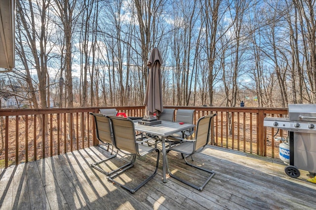 wooden terrace featuring area for grilling