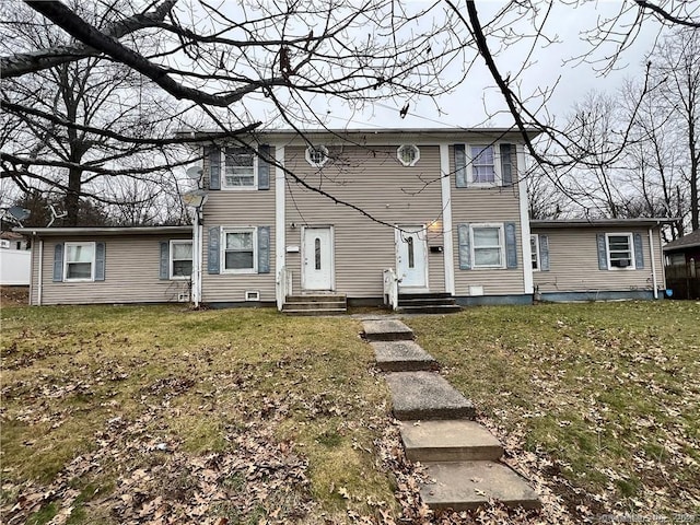 back of house featuring a yard