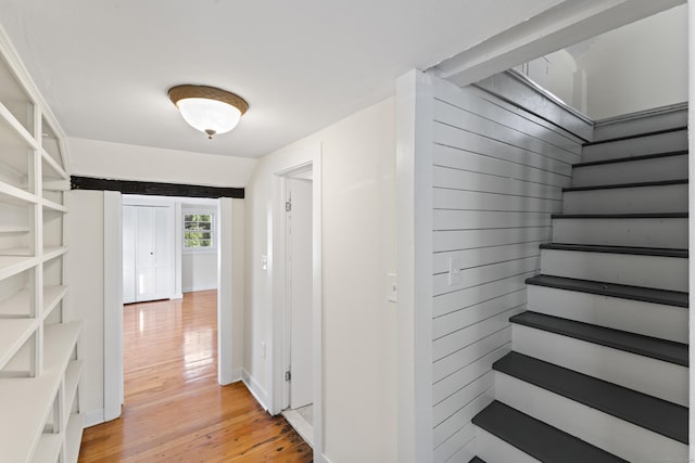 hall with light hardwood / wood-style flooring