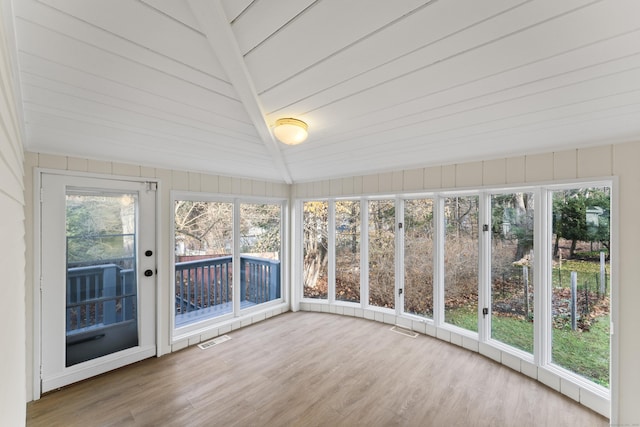 unfurnished sunroom with wood ceiling and vaulted ceiling