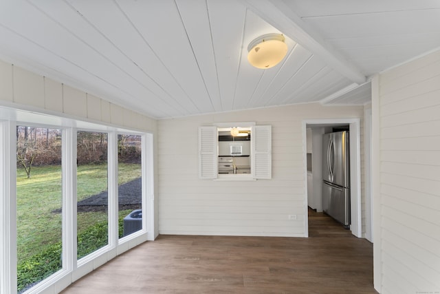 unfurnished sunroom featuring lofted ceiling