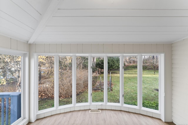 unfurnished sunroom with vaulted ceiling with beams and wooden ceiling