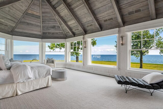 bedroom featuring carpet, wood ceiling, beam ceiling, a water view, and high vaulted ceiling