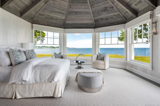 bedroom with carpet, a water view, wood ceiling, and high vaulted ceiling