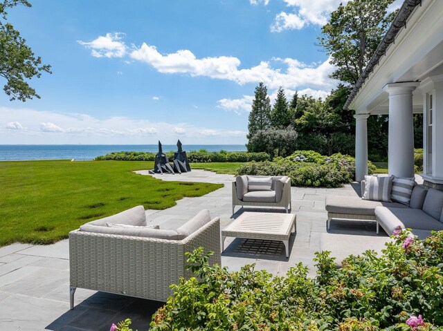 view of patio / terrace featuring a water view and an outdoor hangout area