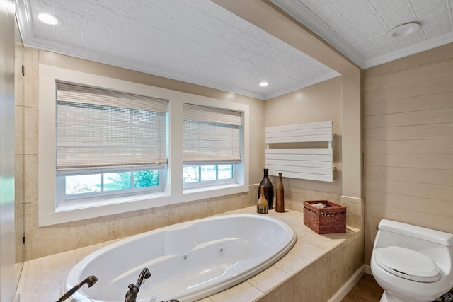 bathroom featuring crown molding, tiled bath, and toilet