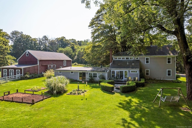 back of property featuring a lawn