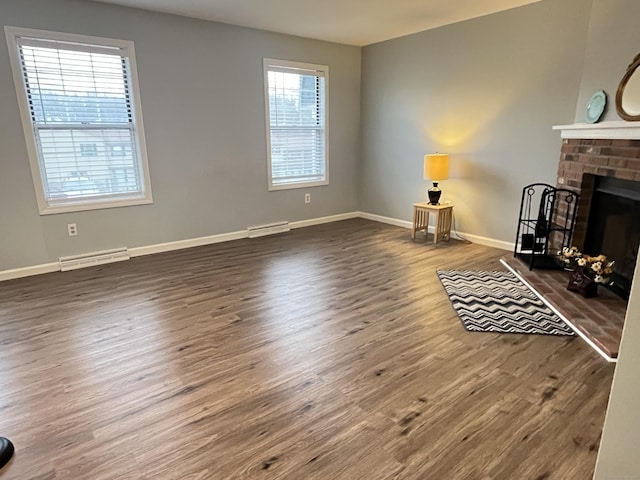 living room with a fireplace and dark wood-type flooring