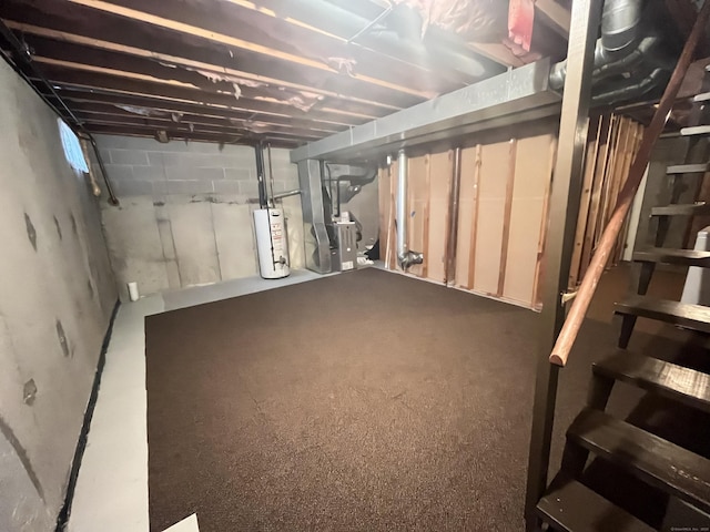 basement featuring heating unit and water heater