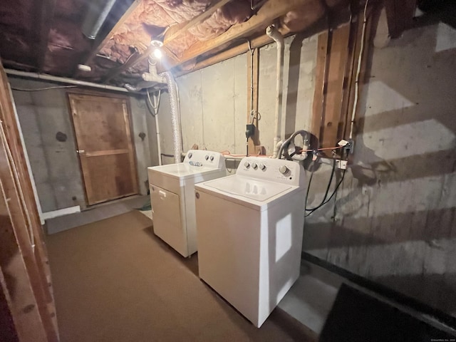 clothes washing area featuring washing machine and clothes dryer