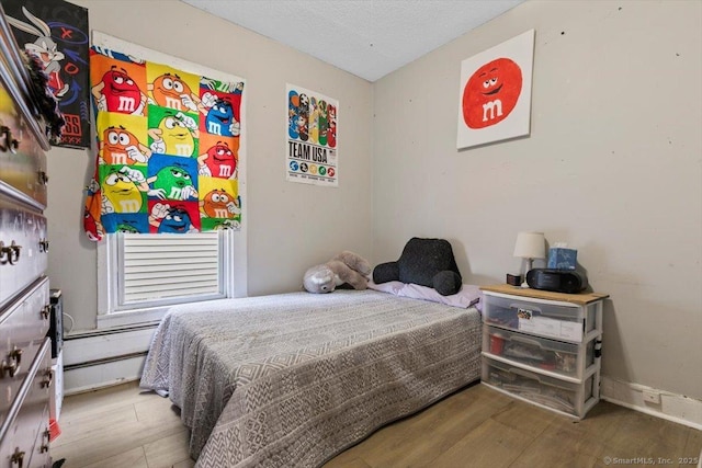 bedroom featuring wood-type flooring