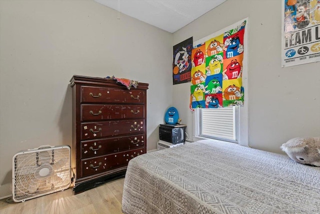 bedroom with light wood-type flooring