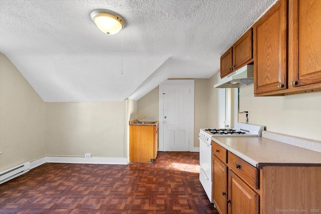 kitchen with a textured ceiling, dark parquet floors, vaulted ceiling, baseboard heating, and white gas stove