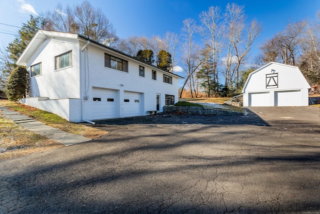 view of home's exterior featuring an outbuilding