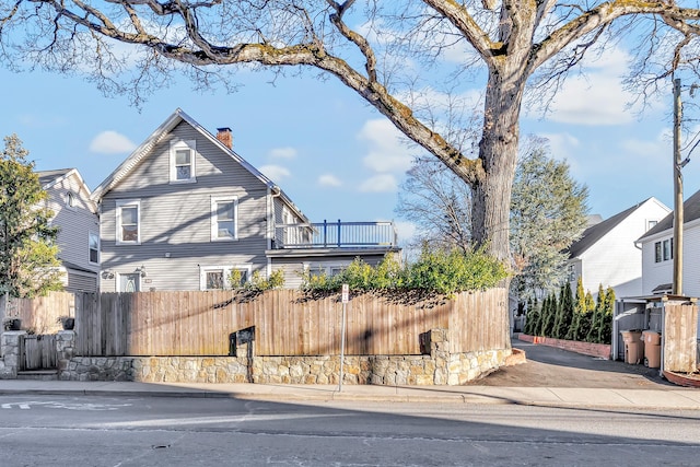 view of property exterior with a balcony