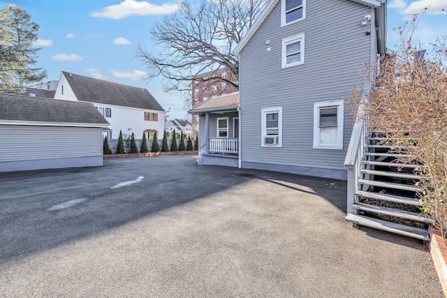 rear view of property featuring cooling unit