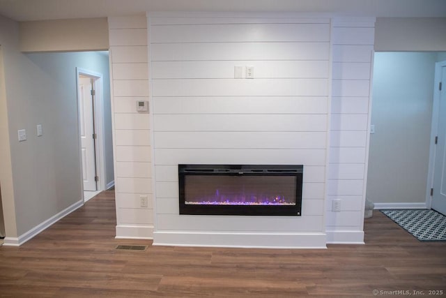 interior details featuring hardwood / wood-style flooring