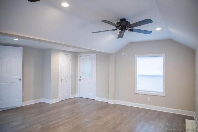 bonus room featuring ceiling fan, wood-type flooring, and vaulted ceiling