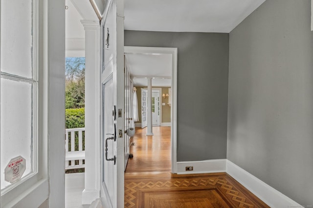 doorway to outside featuring ornate columns