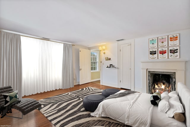 bedroom with hardwood / wood-style flooring