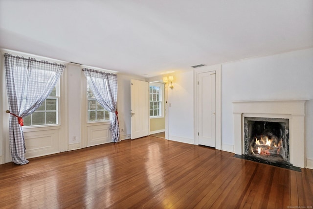 unfurnished living room with wood-type flooring