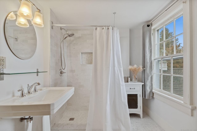 bathroom with walk in shower and tile patterned floors