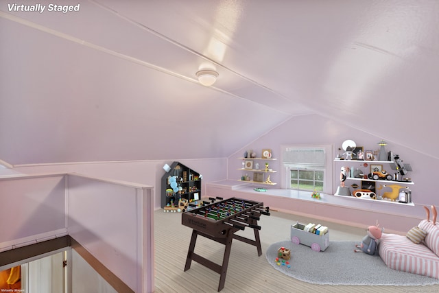 rec room with vaulted ceiling