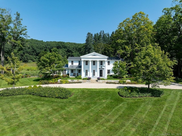 neoclassical / greek revival house with a front yard