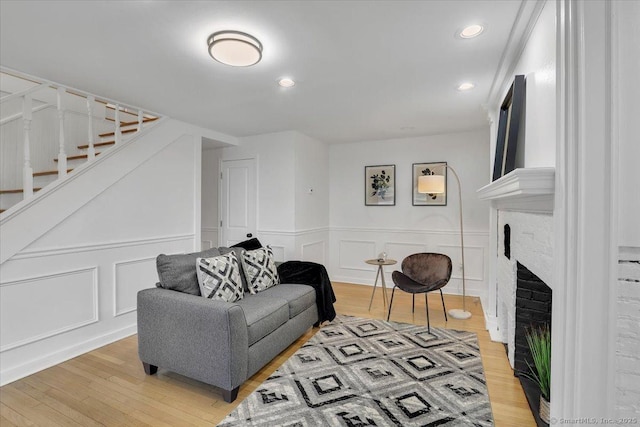 living room featuring a fireplace and hardwood / wood-style flooring