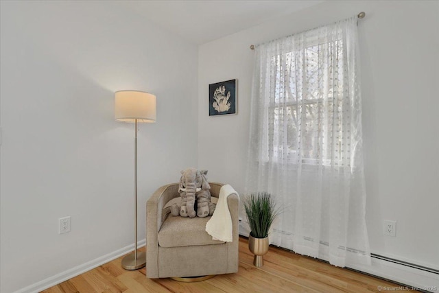 sitting room featuring wood-type flooring