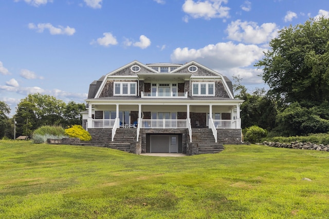 shingle-style home featuring stairs, a porch, and a gambrel roof