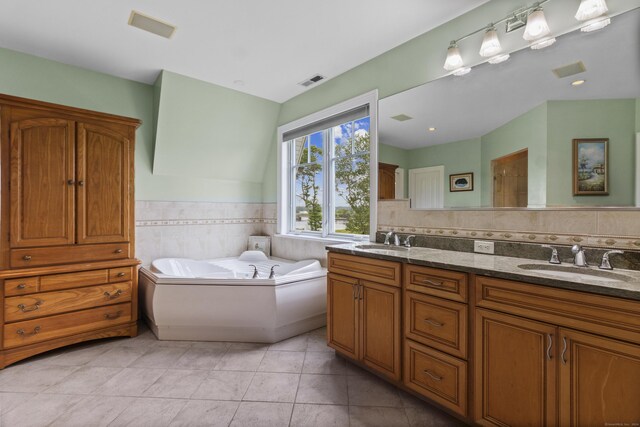 full bath with double vanity, visible vents, a sink, and tile patterned floors