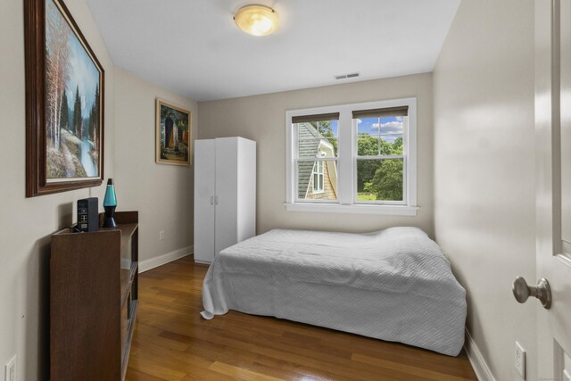 bedroom featuring wood-type flooring