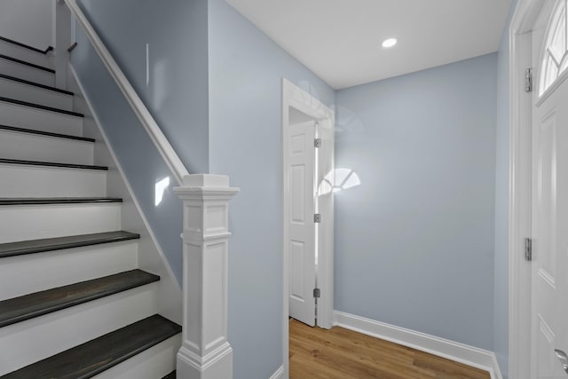 staircase featuring hardwood / wood-style flooring